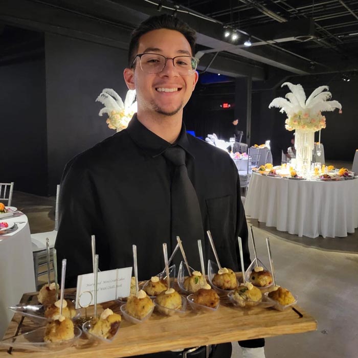 caterer with tray of food